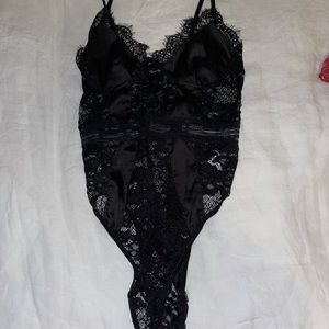 Lace bodysuit, size medium, never worn. Does not fit me